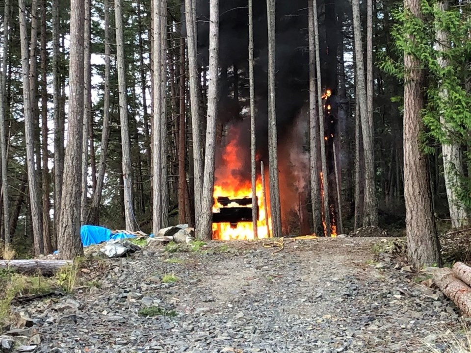 The trailer burning, Oct. 3.