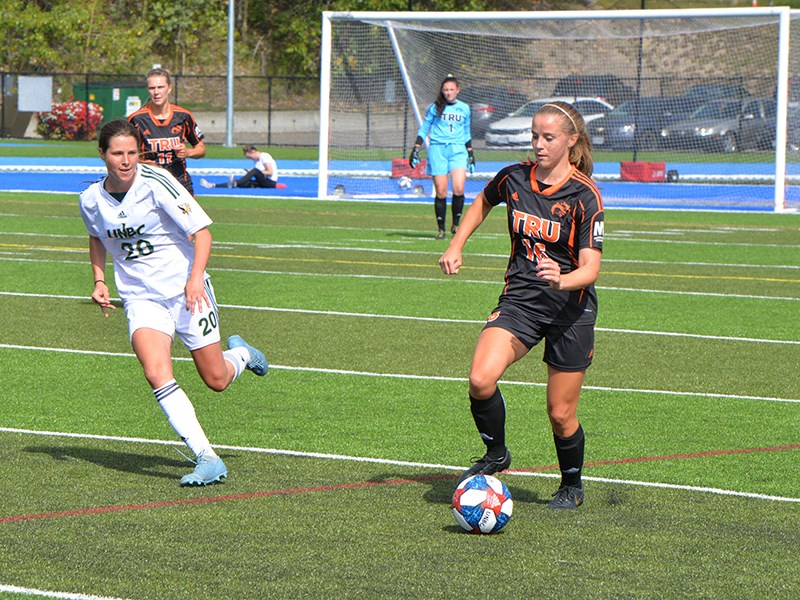 TEAM BUILDER: Natalie Verdeil [right, in black] takes possession of the ball during the home opener for Thompson Rivers University WolfPack against University of Northern BC Timberwolves on September 5. Originally from Powell River, Verdeil has been an integral part of the TRU women’s soccer program during her five years at the university. James Doyle photo