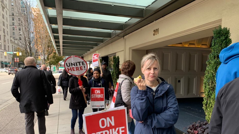 Workers picket outside the Rosewood Hotel Georgia. Photo Glen Korstrom
