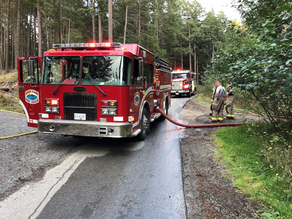 Bowen Island firefighters respond to a fire at Cape Roger Curtis Oct. 3.