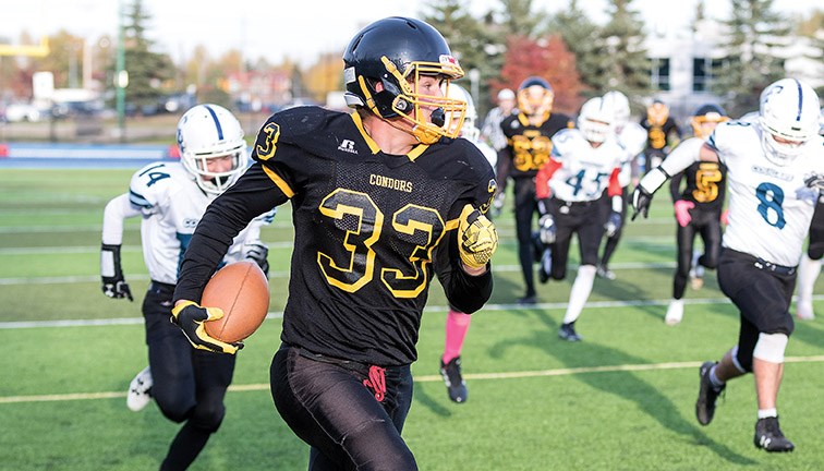 Duchess Park Condors running back Noah Lank runs for a touchdown against the College Heights Cougars last week at Masich Place Stadium.