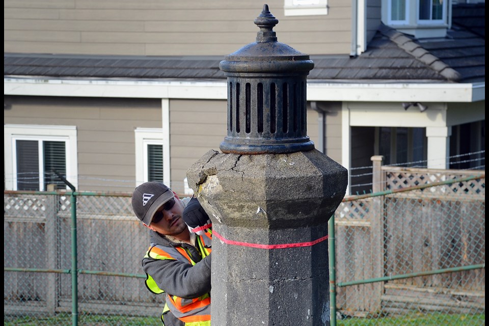 Parks development staffer Branden Dallas measures an air-vent pillar for the 106-year-old Alta Vista Reservoir in South Burnaby.