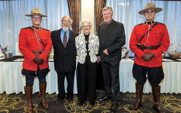 Citizen of the Year recipients Chuck Chin, left, Noreen Rustad, and Albert Koehler pose for a photo with the RCMP Honour Guard at the Coast Inn on Friday evening during the Prince George Community Foundation’s 22nd Annual Citizen of the Year dinner and awards ceremony. Citizen Photo by James Doyle