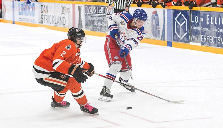 Prince George Spruce Kings forward Preston Brodziak puts a shot on net against Nanaimo Clippers defender Mike Kennedy on Friday at Rolling Mix Concrete Arena. Citizen Photo by James Doyle