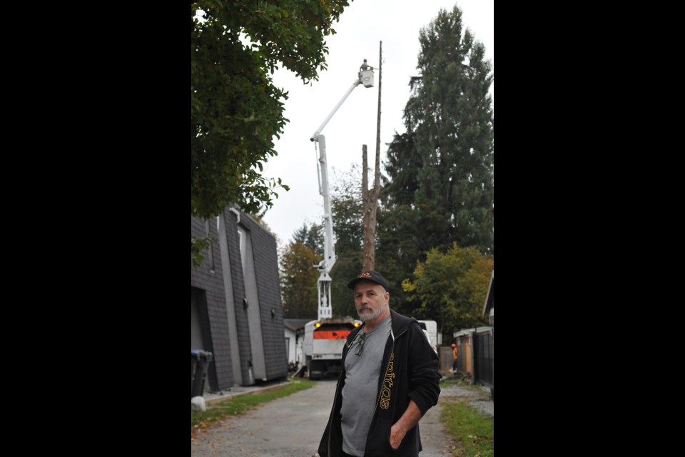 Port Coquitlam resident Frank Pap was upset to see trees being removed next to his house to make way for a lane behind a block of homes on the north side of Prairie Avenue.