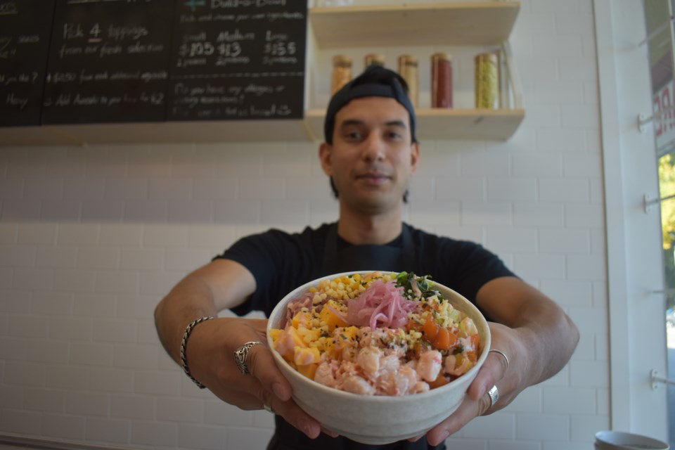 Jonathan Watanabe serves special poke bowls. Nono Shen photo