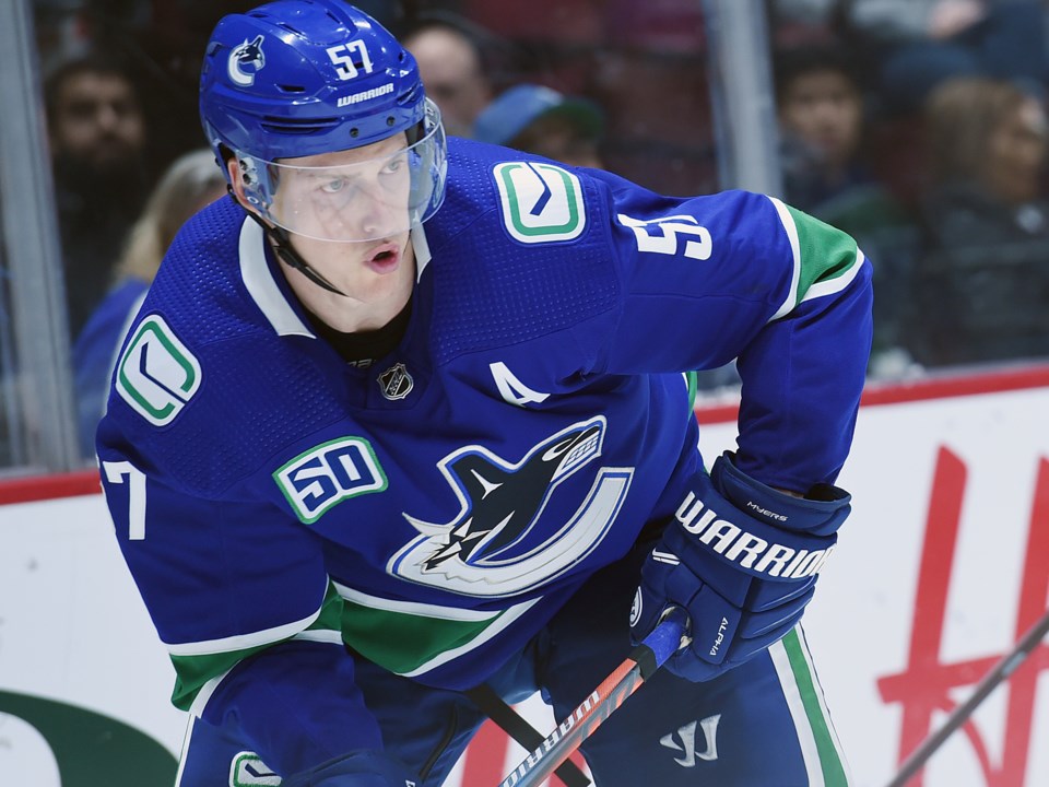 Tyler Myers looks up ice in the Canucks 2019 preseason.