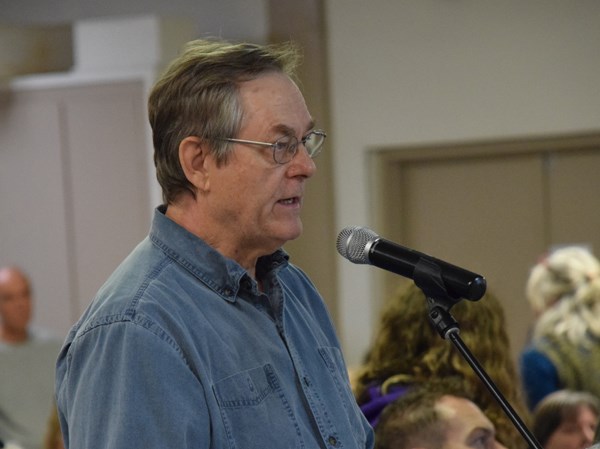 William Baker of Gibsons addresses an Oct. 17 public hearing on a supportive housing project in Gibsons.