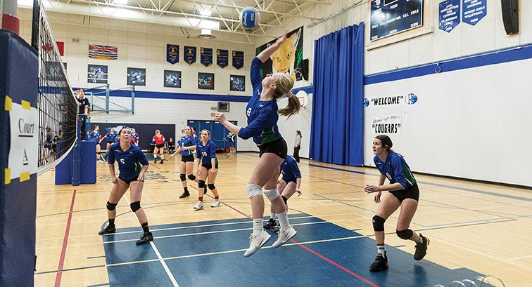 Kelly Road Roadrunners player Brookelyn Van Camp spikes the ball against the PGSS Polars on Saturday afternoon at College Heights Secondary gymnasium as the two teams met in the gold medal game of the College Heights Secondary School Senior Girls Invitational volleyball tournament. Citizen Photo by James Doyle