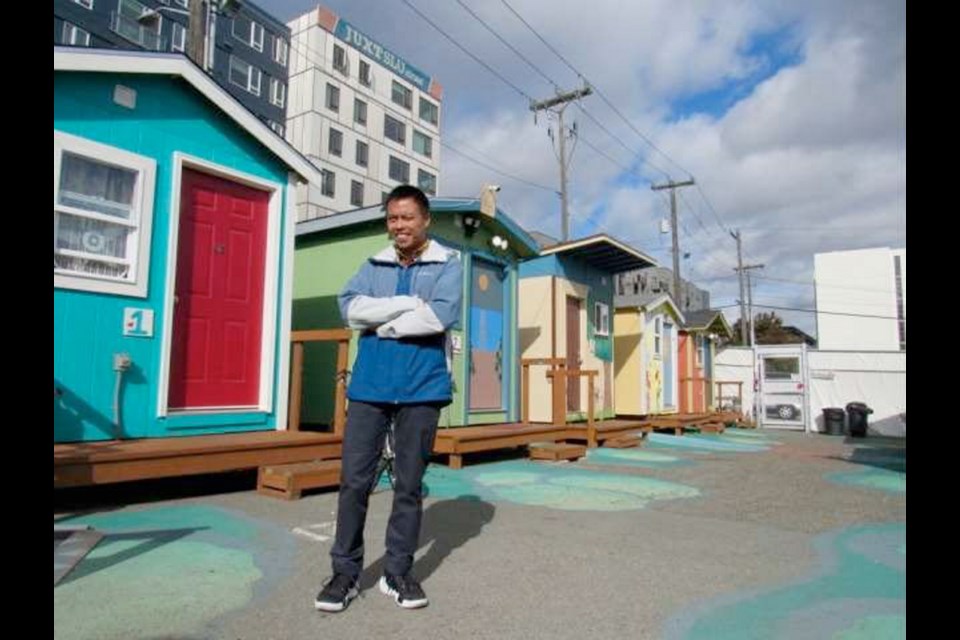 Chris Caculitan, a special projects manager for the Low Income Housing Institute, a Seattle non-profit housing provider, in the Lake Union Village, one of the city&Iacute;s &ntilde;tiny house villages&icirc; for formerly homeless people.