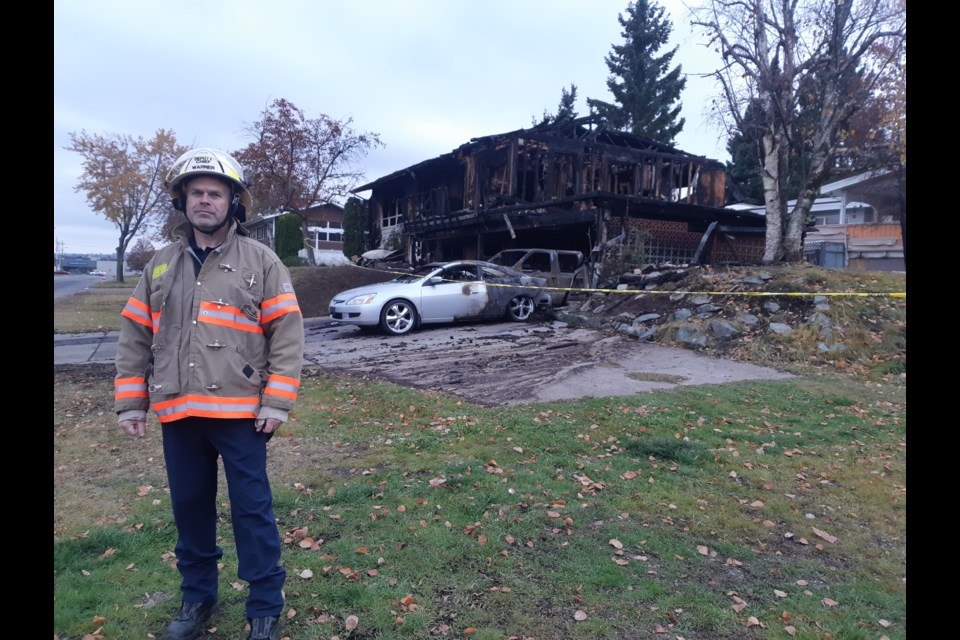 Prince George Fire Rescue deputy chief Cliff Warner surveys the damage at the scene of last week's fatal house fire on Chilako Avenue.
