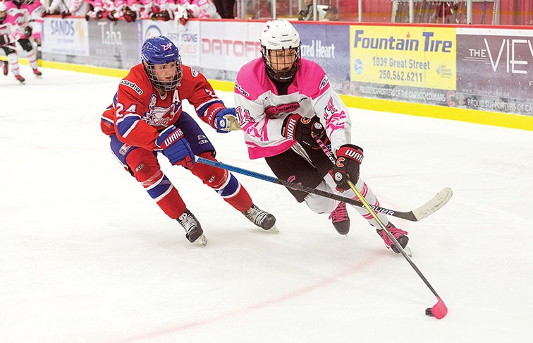 Cariboo Cougars forward Fischer O’Brien cuts hard to the net against Vancouver North East Chiefs defender Nicco Camazzola on Saturday evening at Kin 1. Citizen Photo by James Doyle