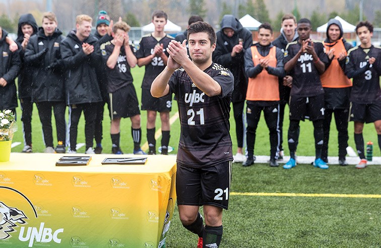 UNBC Timberwolves graduating senior Johnathan Botelho acknowledges the fans cheering for him during a halftime ceremony on Sunday afternoon at Masich Place Stadium. Citizen Photo by James Doyle