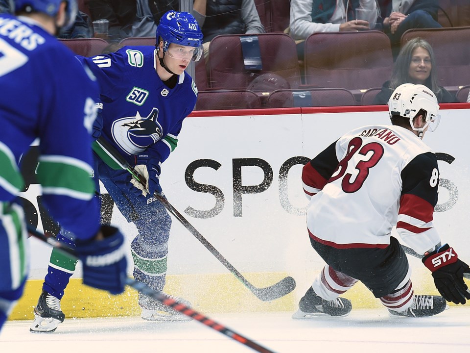 Elias Pettersson passes the puck during the 2019 Canucks preseason