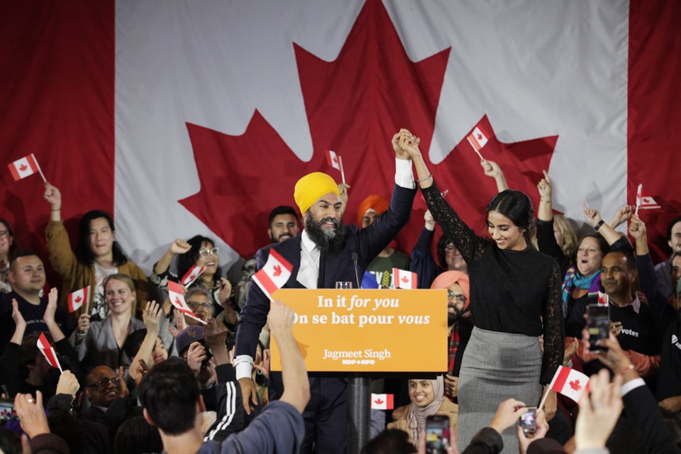 Jagmeet Singh and his wife, Gurkiran Kaur, acknowledge the crowd as Singh appeared to give his speech to Canadians.