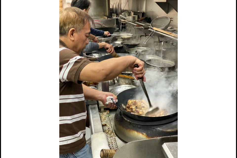Chef from Shiang Garden cooks Braised chicken and abalone clay pots. Photo submitted