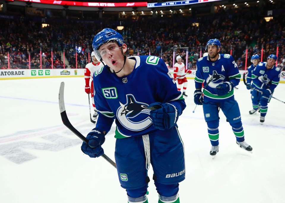 Troy Stecher celebrates a goal for the Vancouver Canucks.