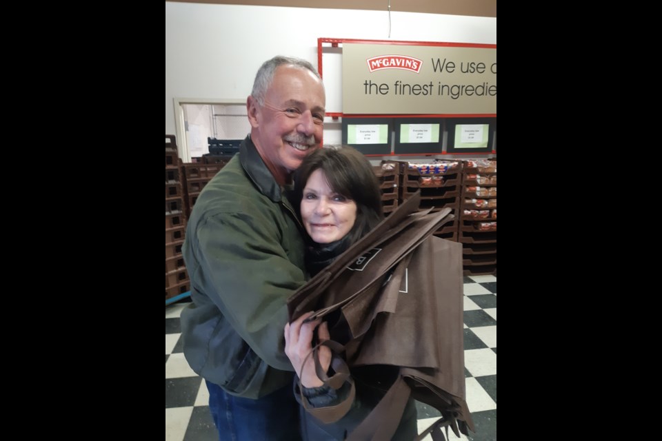 Wally McCue, a longtime customer at the McGavin's Discount Bread Outlet, came by on closing day, Oct. 15, to drop off a gift for store employee Debbie Blakely. The store on Quinn Street closed permanently on Oct. 15.