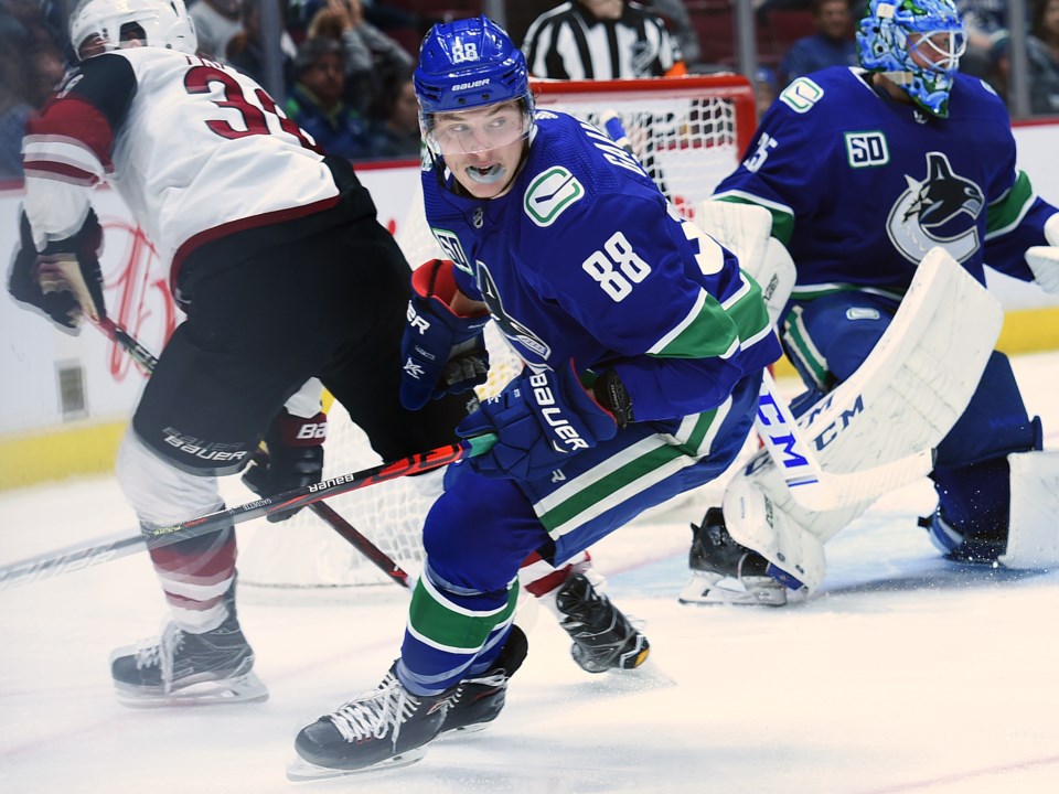 Adam Gaudette turns up ice with the Vancouver Canucks in the 2019 preseason.