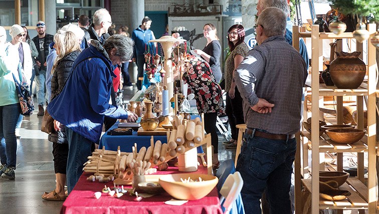 Hundreds browse the vendors lining the halls at UNBC’s main campus on Saturday for the first of two days of the Artisans of the North Fair. Citizen Photo by James Doyle