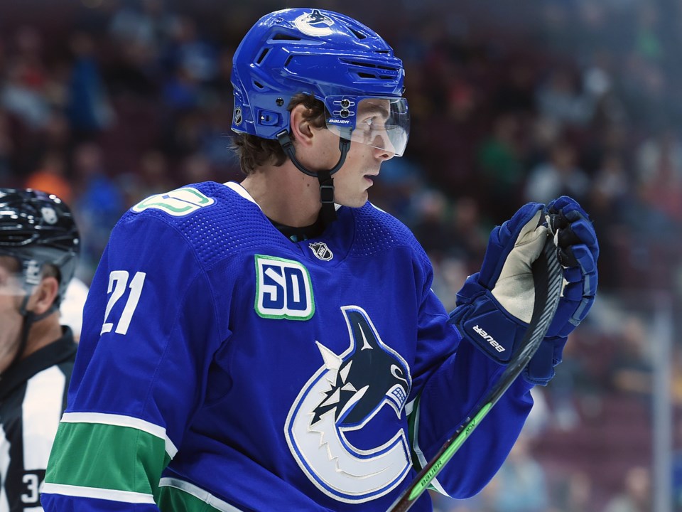 Loui Eriksson checks his stick before a faceoff with the Vancouver Canucks