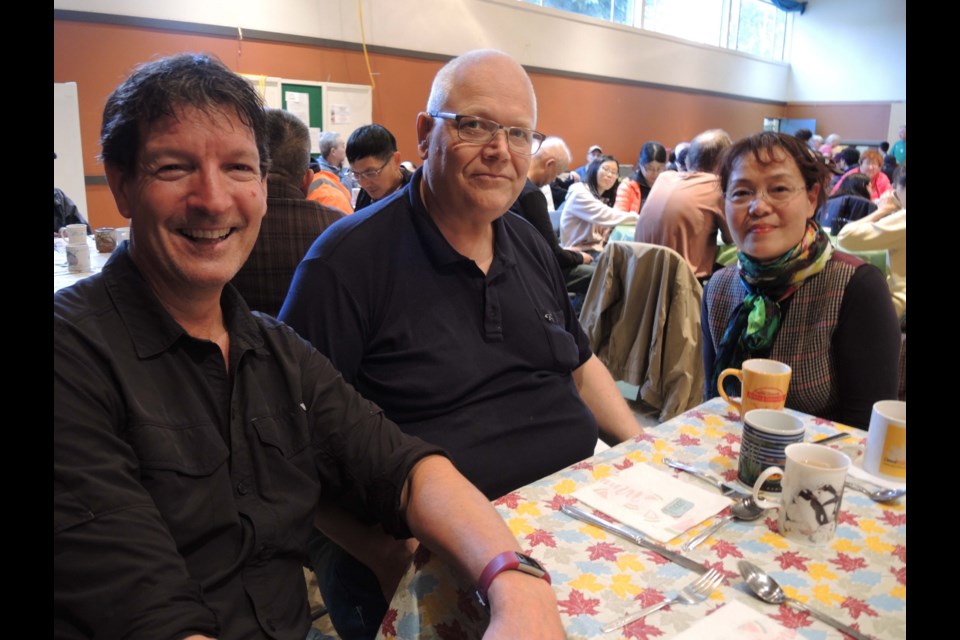 Three members of the Richmond community, including Steven (left and Wesley (centre), who came along for the St. Alban's community meal and now volunteer at the free Tuesday dinner. Alan Campbell photos