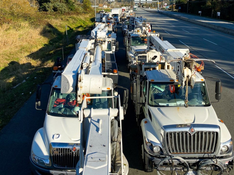 The crew and their 75 utility trucks were held up at a Canada-U.S. truck crossing for several hours.