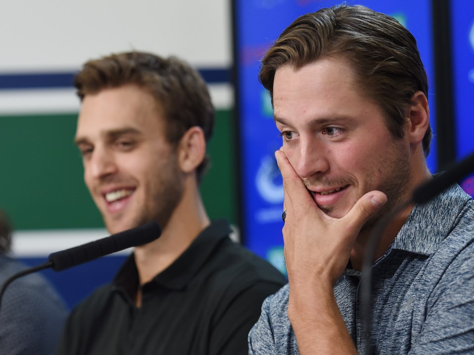 J.T. Miller and Brandon Sutter laugh at the Canucks 2019 media day.