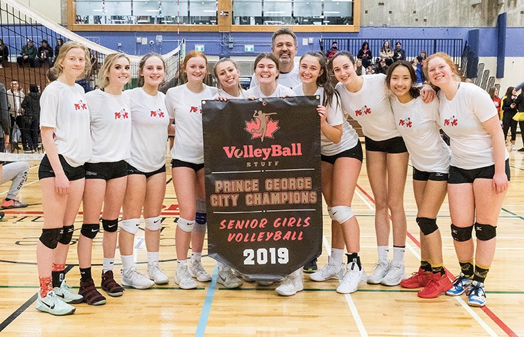 The Duchess Park Condors senior girls volleyball team pose with the banner they won as city champs after defeating the D.P. Todd Trojans on Wednesday evening at College of New Caledonia gymnasium. Citizen Photo by James Doyle