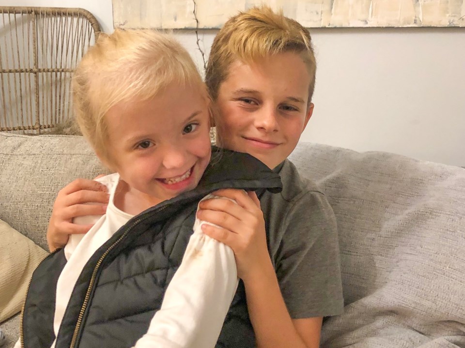 Five-year-old Natalie MacDonald with 12-year-old Tristan Alvarez