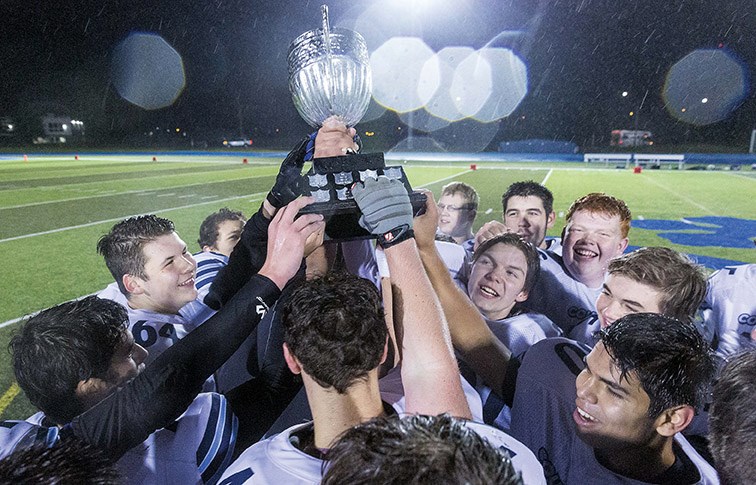 The College Heights Cougars hoist the Matt Pearce Memorial Trophy on Friday evening at Masich Place Stadium after defeating the Nechako Valley Vikings to become P.G. Bowl champs. Citizen Photo by James Doyle