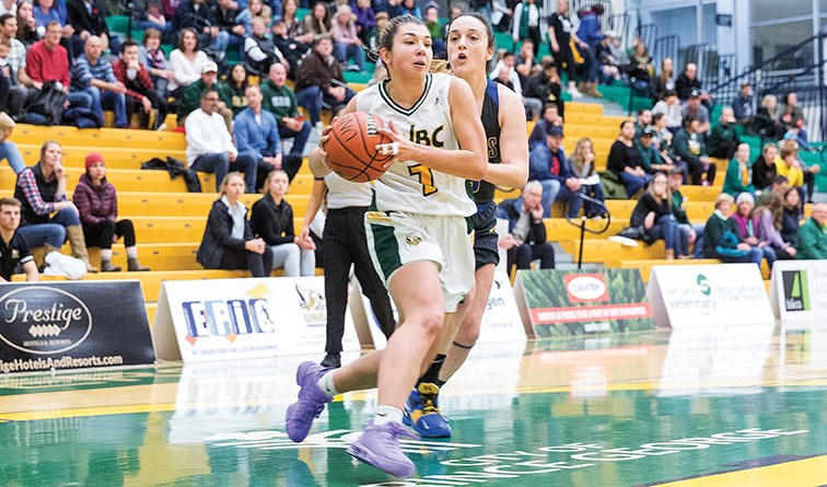 UNBC Timberwolves guard Alina Shakirova drives to the net against University of Victoria Vikes guard Kristy Gallagher on Friday evening at Northern Sport Centre. Citizen Photo by James Doyle