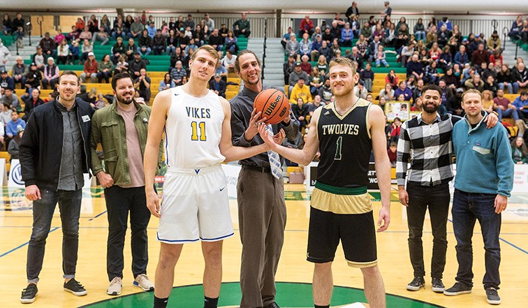 UNBC Timberwolves alumni Kevan Madsen prepares to throw the ball up for Timberwolves player Anthony Hokanson and University of Victoria Vikes Hayden Lejeune during a ceremony honouring players from UNBC’s CCAA National Championship winning team on Saturday night at Northern Sport Centre. Citizen Photo by James Doyle