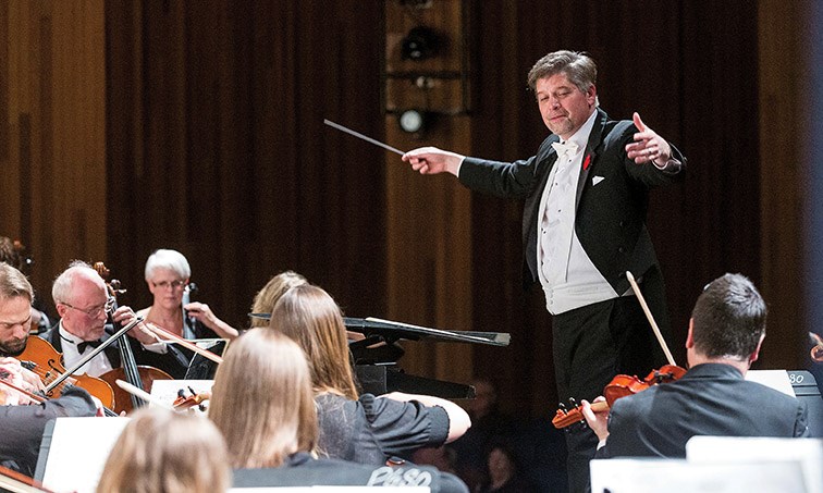 Conductor Michael Hall leads the Prince George Symphony Orchestra during their performance of We Remember on Saturday night at Vanier Hall. Citizen Photo by James Doyle