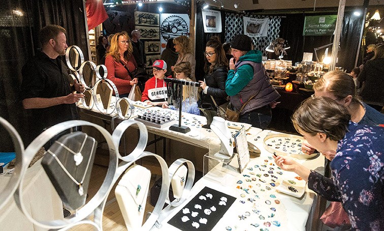 Patrons check out a booth of one of the over 200 vendors at the 43rd annual Studio Fair on Saturday at Prince George Civic Centre. Citizen Photo by James Doyle