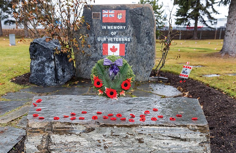 Poppies and a wreath sit on the Veterans Memorial at Memorial Park Cemetery after being placed there during the Military Church Parade and Veterans Memorial Ceremony on Sunday morning. Citizen Photo by James Doyle