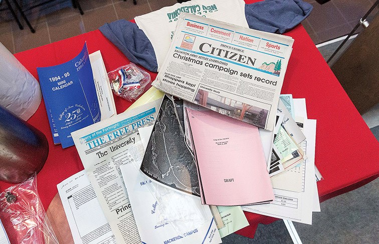 Items from the 50th anniversary time capsule sit on a table at CNC on Wednesday afternoon. The capsule was sealed in 1994 and opened during a ceremony to mark the 50th anniversary of the college. Citizen Photo