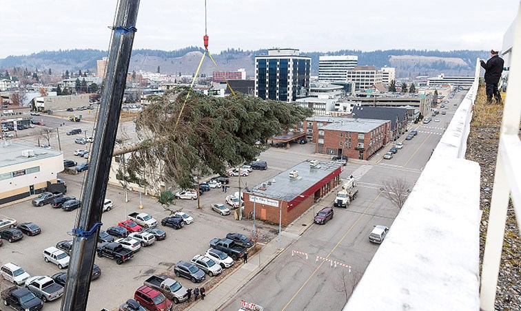 A crane lifts the 60-foot Tree of Lights onto the roof of the Coast Prince George Hotel by Apa on Wednesday afternoon. Citizen Photo by James Doyle