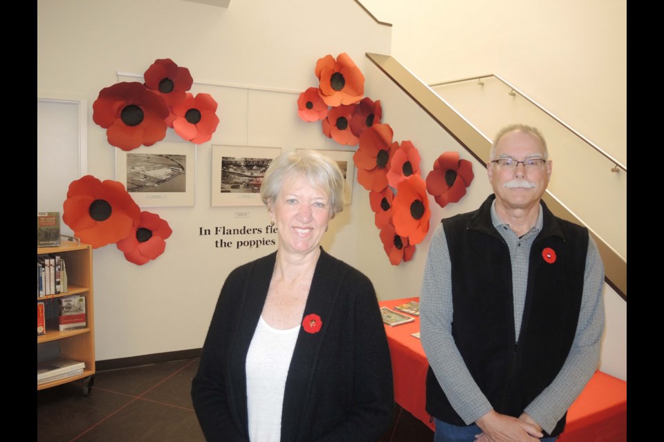 Friends of the Richmond Archives president Christine McGilvray and social media coordinator John Campbell are inviting the public to check out their Remembrance display at Richmond Public Library’s Brighouse branch. Alan Campbell photo