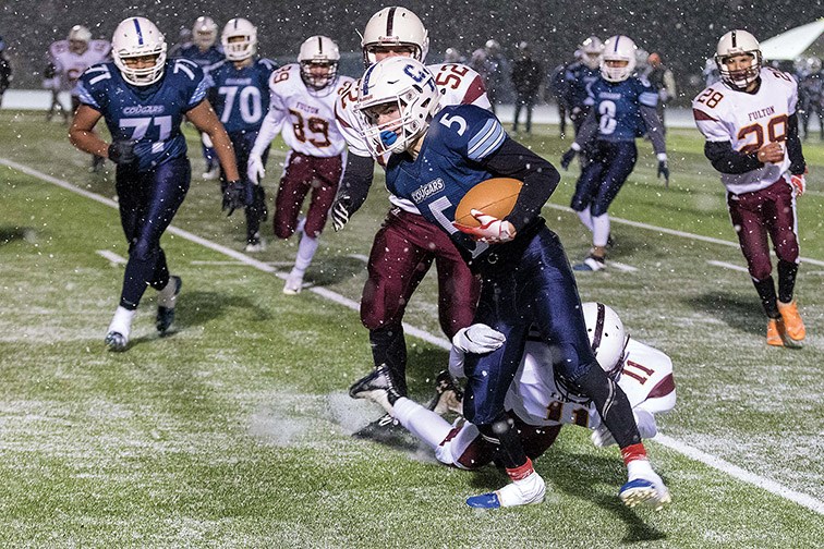 College Heights Cougars player Austin Adams runs the ball down field against the Clarence Fulton Maroons on Saturday evening at Masich Place Stadium. The two teams met in a B.C. Secondary Schools AA Varsity wildcard playoff game. Citizen Photo by James Doyle