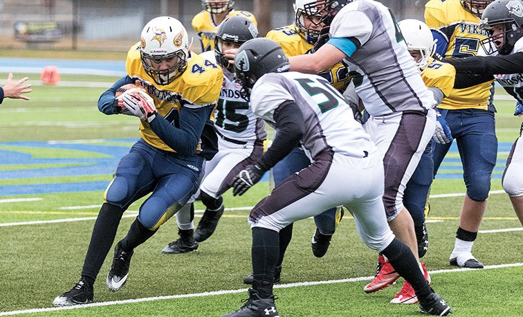 Nechako Valley Vikings player Garrett Dick runs the ball against the Windsor Dukes on Saturday afternoon at Masich Place Stadium. The two teams met in a B.C. Secondary Schools AA Varsity wildcard playoff game. Citizen Photo by James Doyle