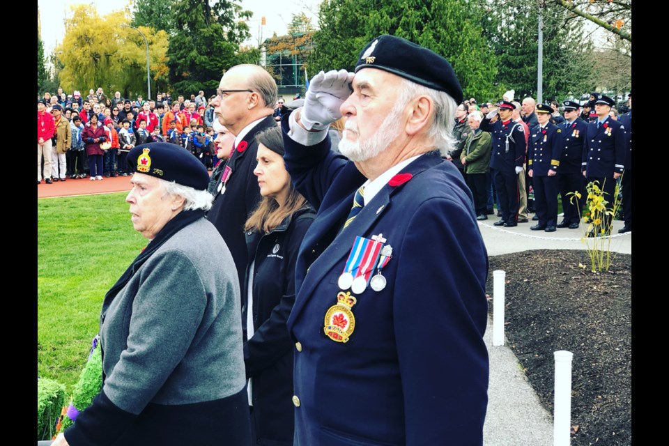 A veteran salutes during the moment of silence at the North Burnaby Remembrance Day ceremony. Chris Campbell photo