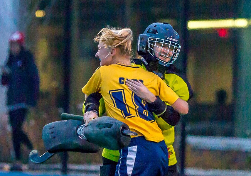 Collingwood defender Jamie Borthwick embraces goalkeeper Mo Kelly following the team’s 2-0 win over Shawnigan Lake in the senior girls AA field hockey provincial final Friday in Victoria. It was Collingwood’s third straight title. photo islandwavephotography.com