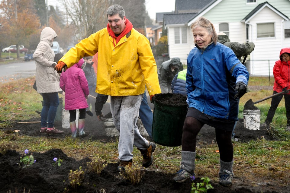 Local community members, in partnership with the Parks and Recreation Department, planted a pollinator garden in the boulevard at the intersection of London and 22nd Street on Saturday.