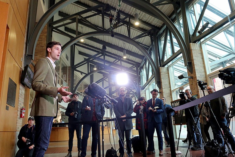 Port Moody mayor Rob Vagramov takes questions from the media after making a statement to announce his intention to return to office now that his charge of sexual assault has been stayed. Vagramov was on leave for several months after the charge was filed, returned briefly and then went back on leave.