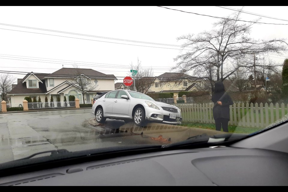 A silver car somehow came to a stop on a concrete barrier at the corner of No. 4 and Alexandra roads.