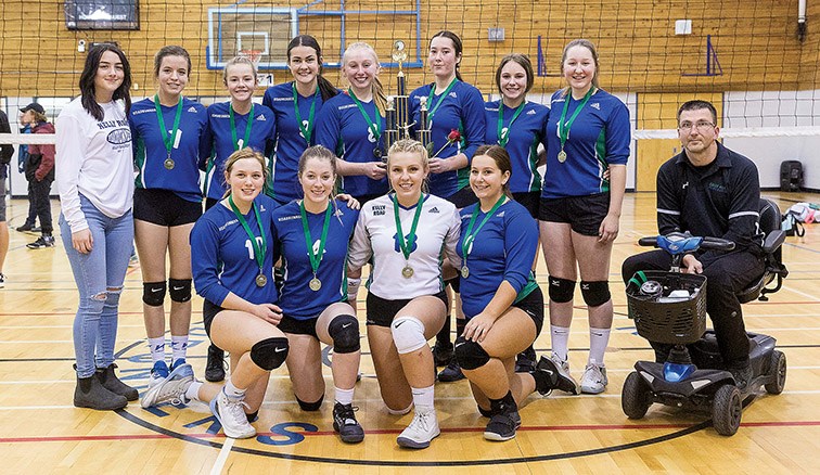 Kelly Road Roadrunners players pose with their trophy after defeating the D.P. Todd Trojans on Saturday afternoon at Kelly Road gymnasium to claim the Senior Girls AA North Central Zone volleyball championship. Citizen Photo by James Doyle