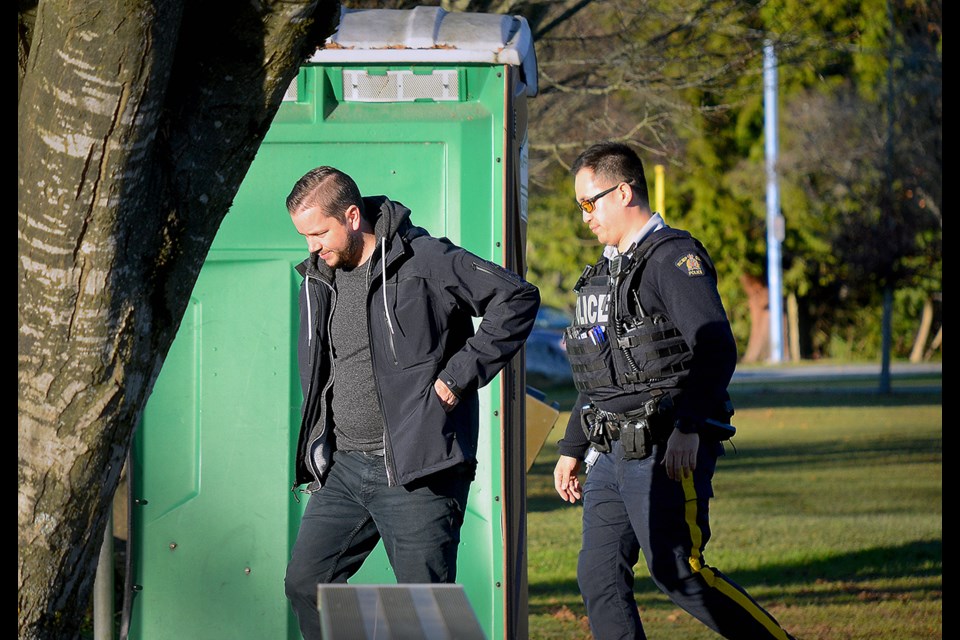Police were on scene at Charles Rummel Park in Burnaby Thursday after a body was discovered in the portable toilet.