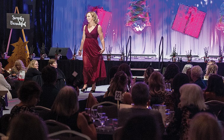 Citizen Photo by James Doyle. A model walks the runway showcasing fashion from Simply Beautiful on Friday night at Prince George Civic Centre during the Canadian Tire Fashion Show. The annual fashion show opened the 26th Annual Festival of Trees.