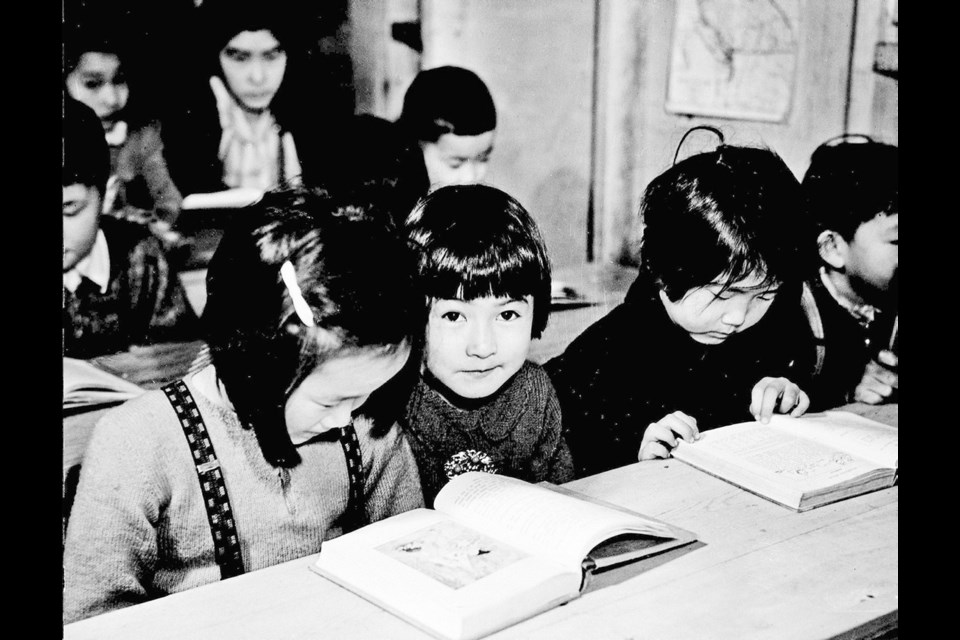 Grade 1 students studying in tarpaper shacks, New Denver, circa 1943. Library and Archives Canada, C-067492